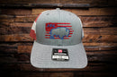 Front view of Richardson 112 trucker hat with heather gray front, red and white mesh back, blue buffalo embroidery over red flag stripes, and AFG stitched above.